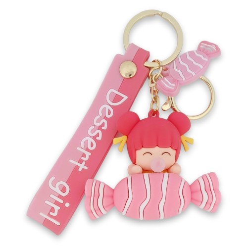 Porte-clés petite fille sur un gros bonbon
