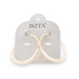 Boucles d'oreilles créoles métal doré détails tissu écru marque Ikita